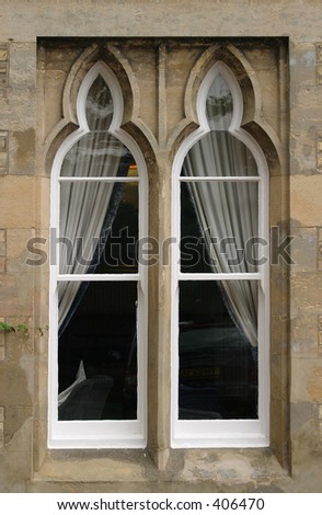 two section arched box sash window with stone outer