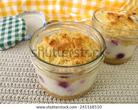 Cake in jar with berries and yogurt