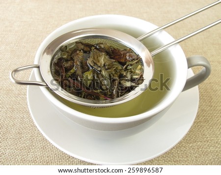 Peppermint tea in tea strainer