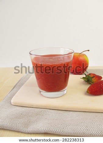 Strawberry apple smoothie in glass