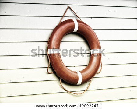 life belt, rescue ring (40) on wooden wall