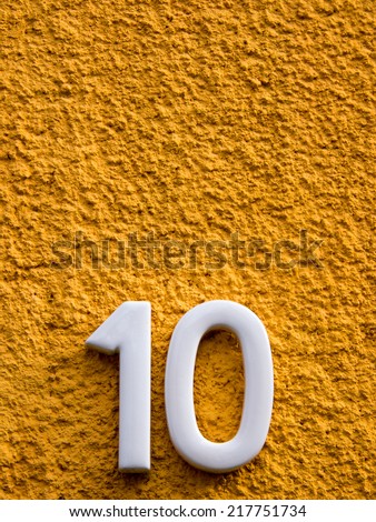 number ten  on a house wall