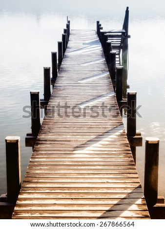 wooden jetty at a little lake in upper bavaria