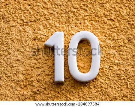 number ten  on a house wall