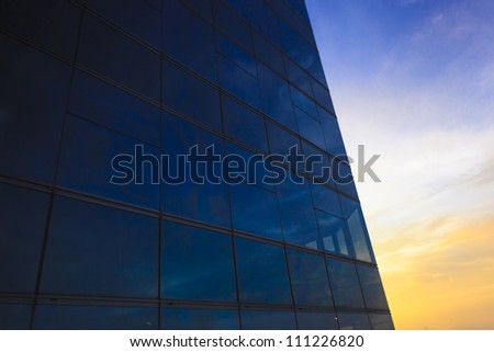 window reflection at sunset time as blue background