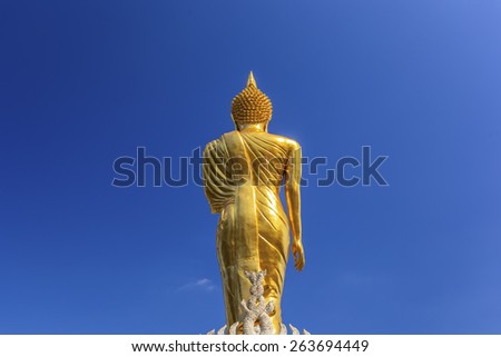 Buddha statue at back on sky background