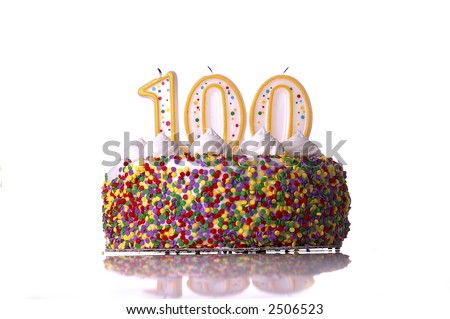 birthday cake 100 candles.  A colorful birthday cake with candles shaped like the number 100. White