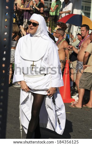 Provincetown, Massachusetts, USA-August 19, 2010: Man walking in the Annual Provincetown Carnival Parade in Provincetown, Massachusetts.