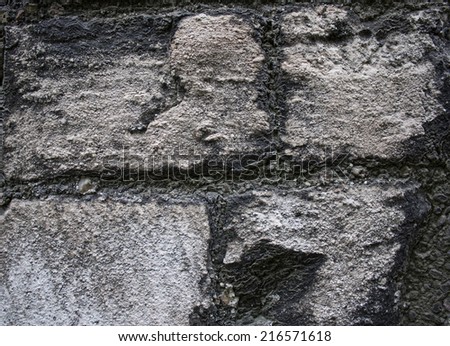 Rough gray rock wall background texture