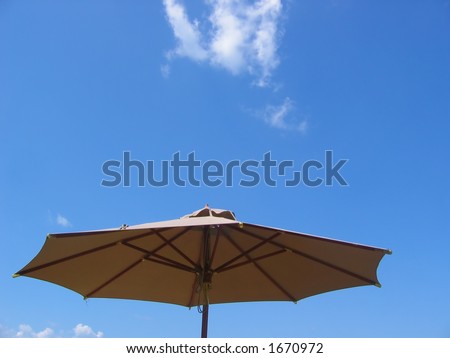 Patio umbrella with blue sky background