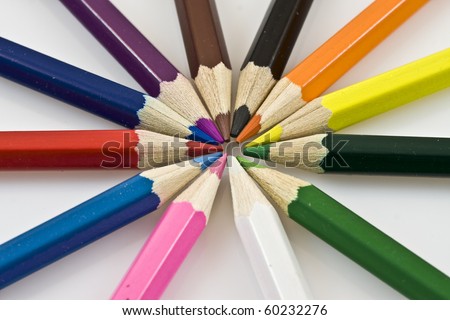 Close-up of a selection of colored pencil crayons, arranged like a color wheel