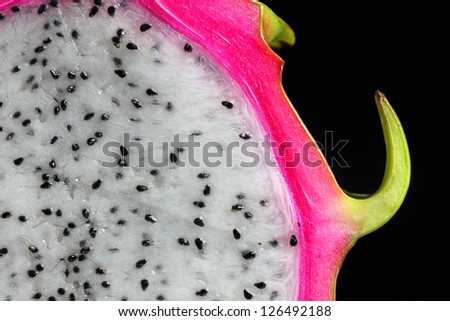Close up of half dragon Fruit on black background