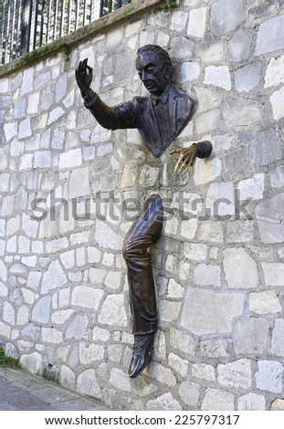 PARIS - OCTOBER 18: Marcel Ayme monument in Montmartre - man who walked through walls in Paris, France. October 18, 2014.
