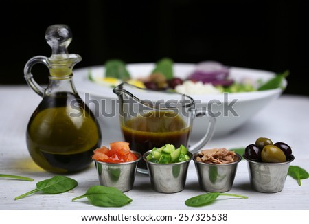 Nicoise salad ingredients with sauce