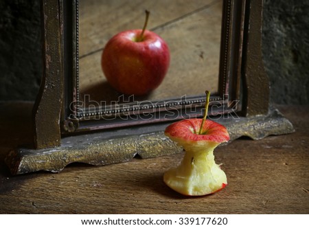 Apple reflecting in the mirror