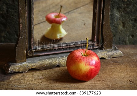 Apple reflecting in the mirror