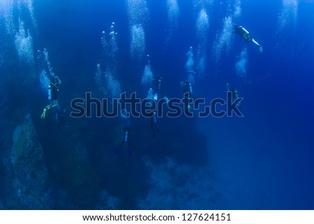 KHAO LAK, THAILAND - MARCH 27: Un-identified scuba divers desending on a dive site in Similan Islands on March 27, 2010. The Similans are popular with divers coming form Khao Lak on daytrips.