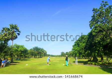 PATTAYA, THAILAND - MAY 29: Unidentified men tee off on 1st hole on Green Valley St Andrews golf course on May 29, 2013. Pattaya has 25 golf courses close to the city.