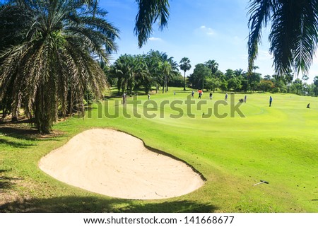PATTAYA, THAILAND - MAY 29: Unidentified men on green at 8th hole on Green Valley St Andrews golf course on May 29, 2013. Pattaya has 25 golf courses close to the city.