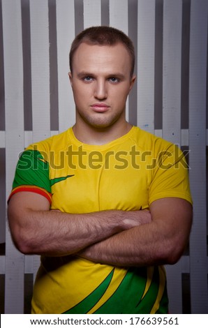 Young attractive man in sportswear. Serious facial expression