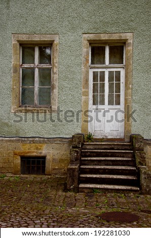 The door on the old porch with windows