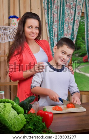 Mom and son preparing food in the kitchen