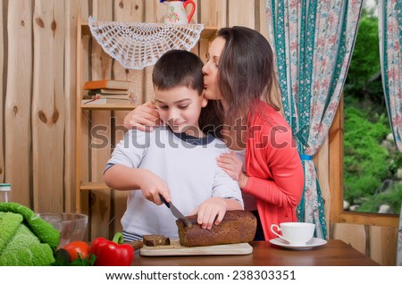 Mom and son preparing food in the kitchen
