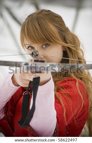 stock photo Medieval girl shoots a crossbow