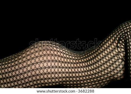 a lying woman in a black net stocking