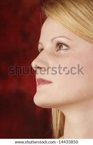 blond woman in profile with a serious look