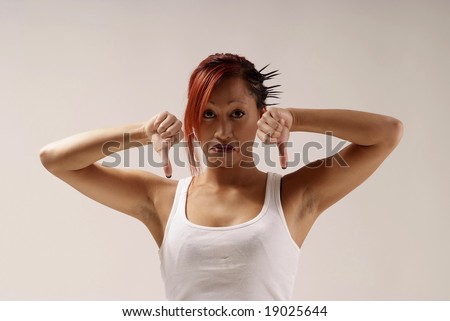 young woman with white top holding both thumbs down