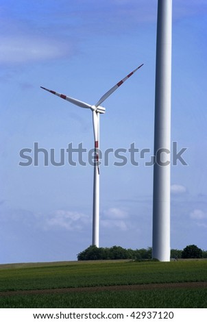 big windmill green field meadow blue sky