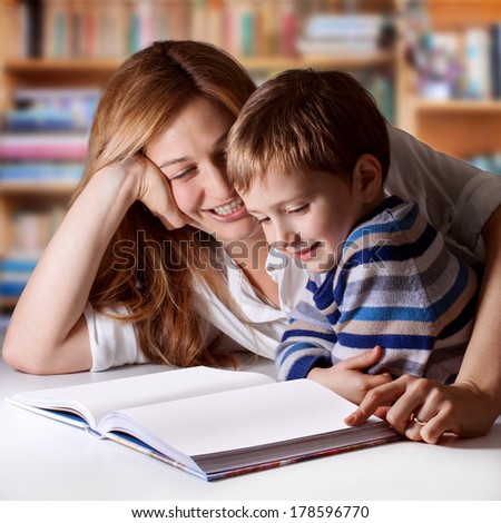 Mother reading Bible stories to her boy