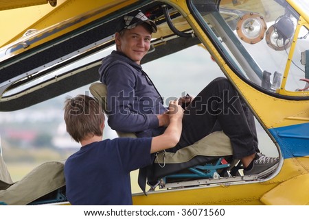 Young man sitting in a plane for a flight lesson