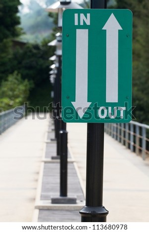 Walk way with in and out sign