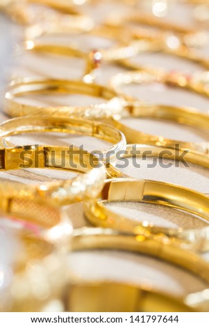 Arrangement of gold bangles in a shop