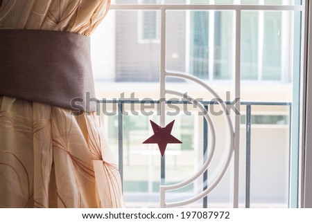 curved steel and brown curtain