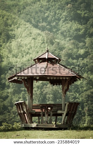 old wooden pavilion in garden