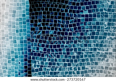 rough blue mosaic tile wall in bathroom