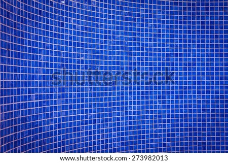 rough blue mosaic tile wall in bathroom