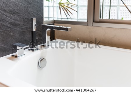 closeup faucet of bathtub in bathroom