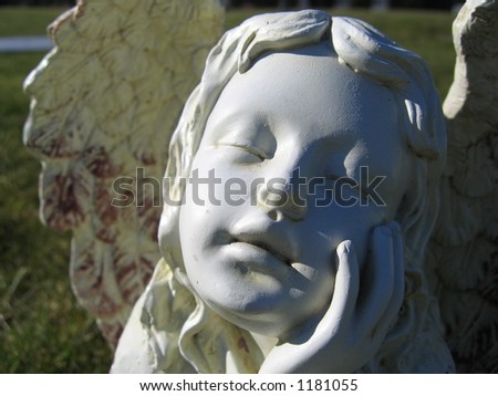 Angel statue smiling towards the sun