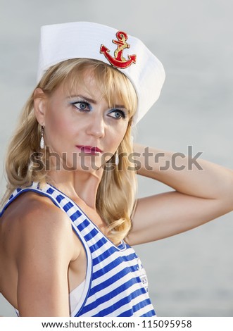 Sailor model on the beach
