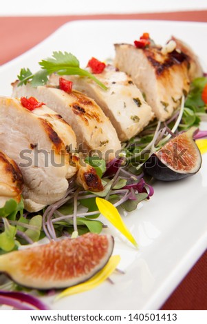 Margarita Chicken breast, grilled, over Micro Greens salad with edible flowers and black figs.