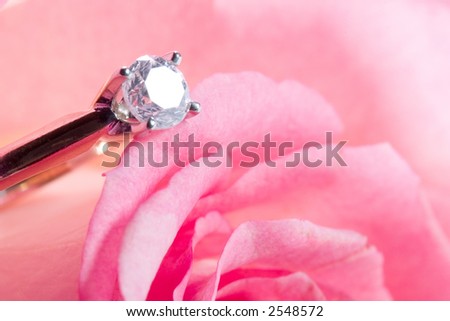 Romantic way to present a diamond ring inside beautiful rose on Valentine day.