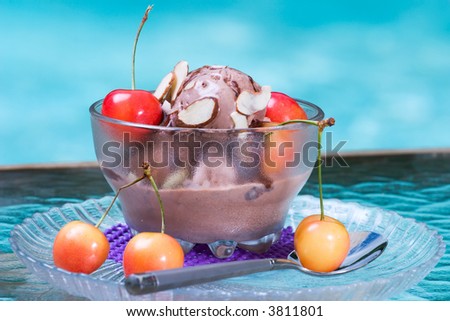 Closeup of delicious Chocolate Cherry Almond Sundae dessert served on pool side