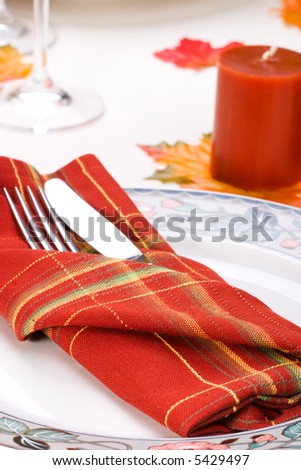 Closeup of silverware for fall festive theme dinner table arrangement