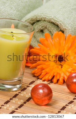 Fresh marigold spa set with fresh and dried flowers, aromatic oil balls, towels and aroma candles. Best suited for relaxing and health commercials