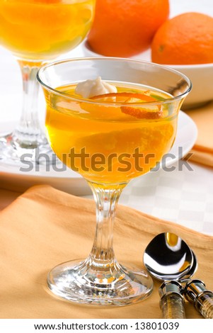 Delicious Champagne Orange jelly served with whipped cream and orange zest