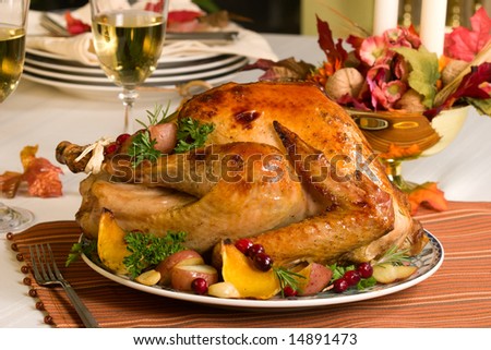 Feasting backed turkey on holiday table ready to eat